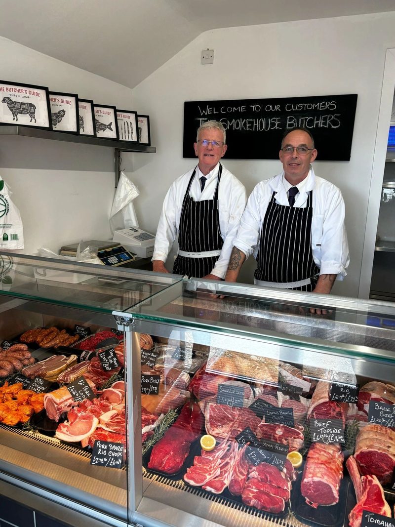 Smokehouse Butchery website showing the butchers behind a full counter